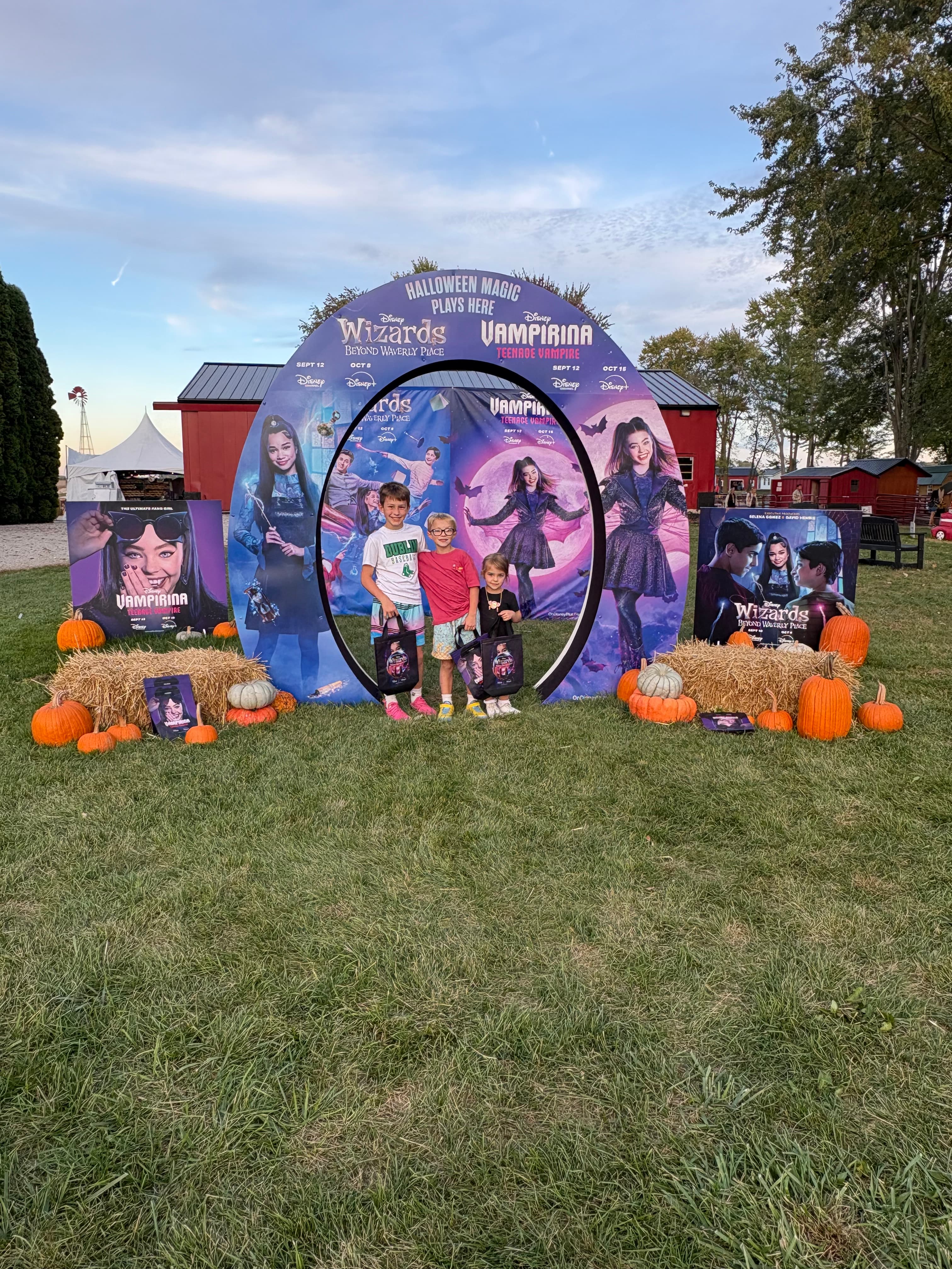 A children's television campaign photo display set among pumpkins and hay bales at a pumpkin farm